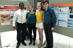 Jessica and Aubrey (center) pose with summer undergrads Brian and Daniel during their final poster session.